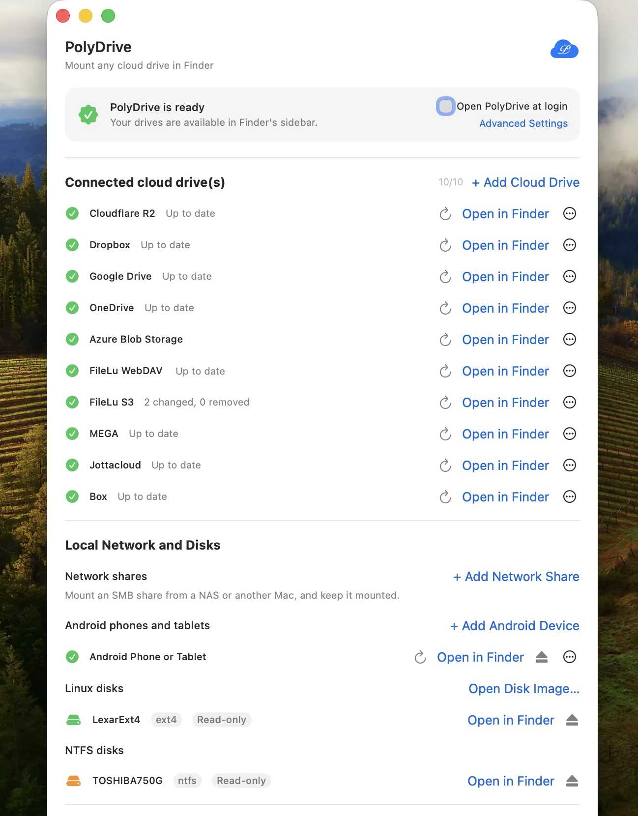 PolyDrive window listing ten connected cloud drives — including Cloudflare R2, Dropbox, Google Drive, OneDrive, MEGA, Jottacloud and Box — plus an Android phone and local ext4 and NTFS disks mounted read-only